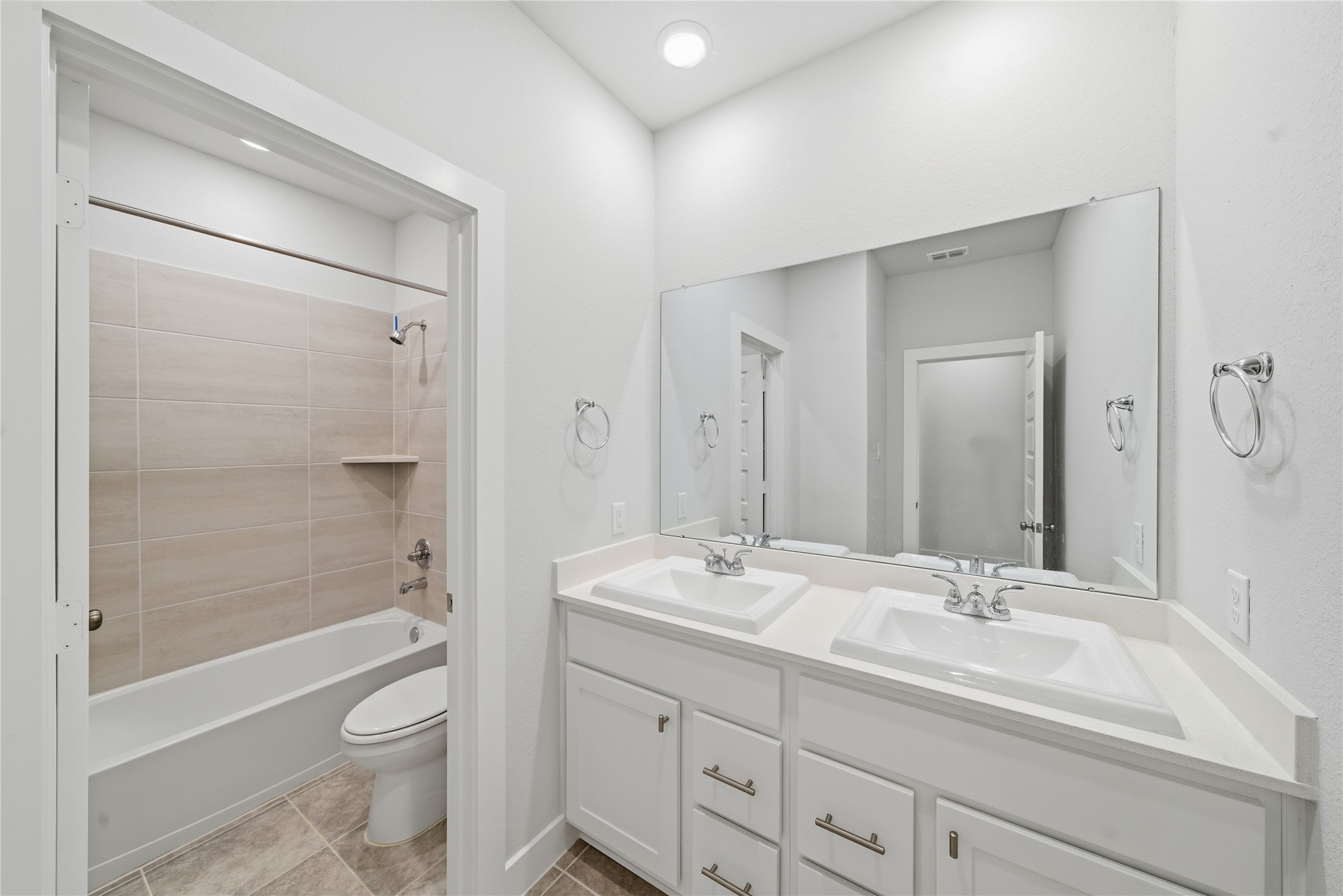 31719 Hatcher Grv Lane Fulshear, TX 77441 - Photo 30 of 40 a bathroom with a sink a toilet and shower