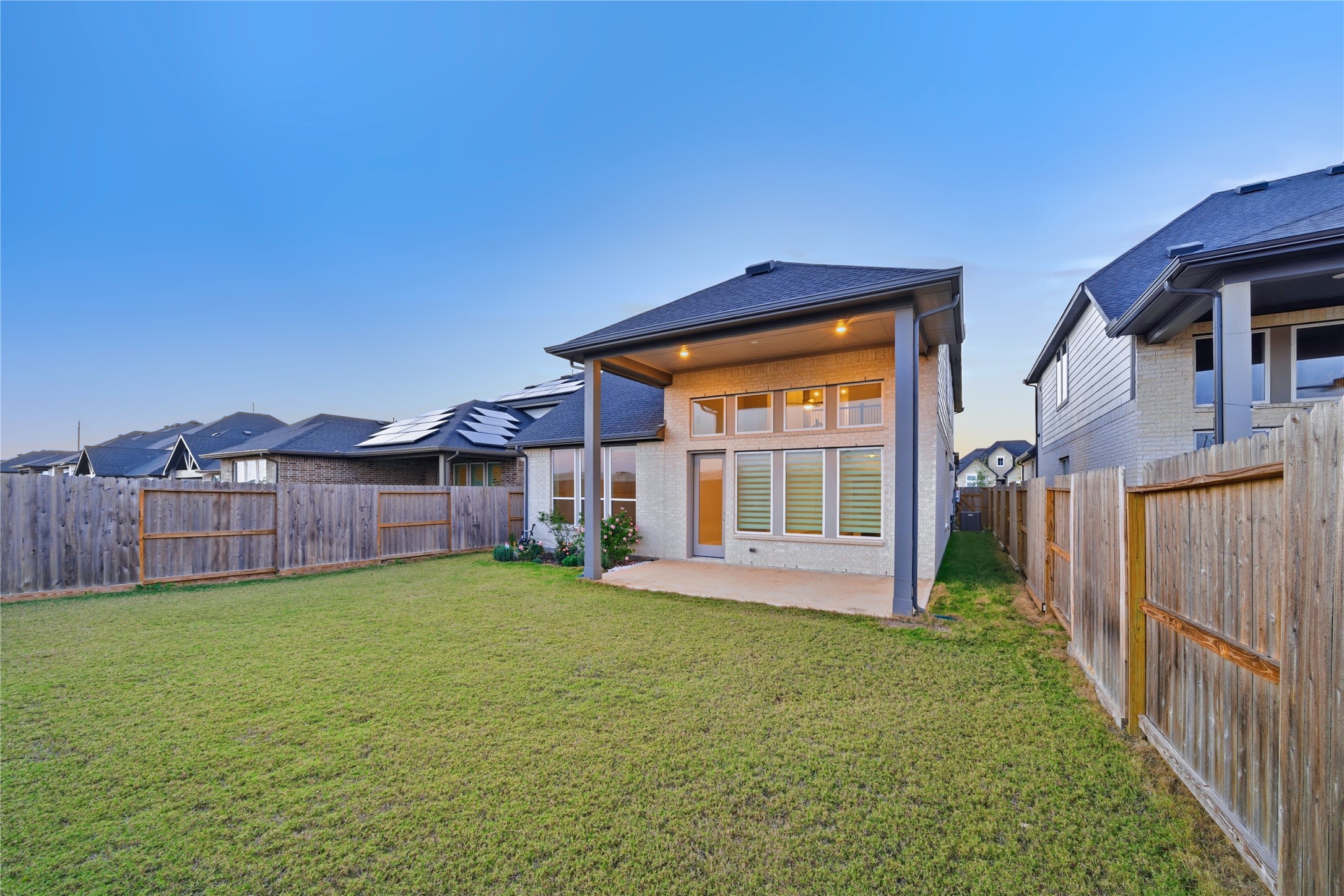 31719 Hatcher Grv Lane Fulshear, TX 77441 - Photo 36 of 40 a view of a house with a yard and wooden fence