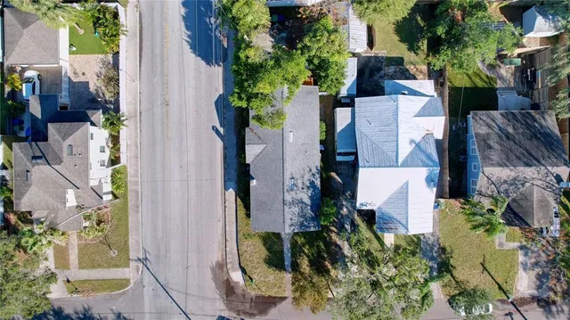 an aerial view of a house with outdoor space