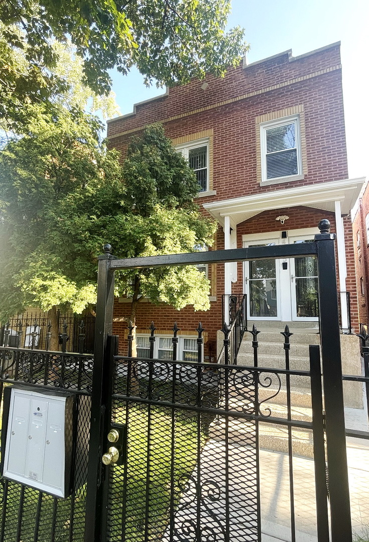 a view of a house with backyard porch and sitting area