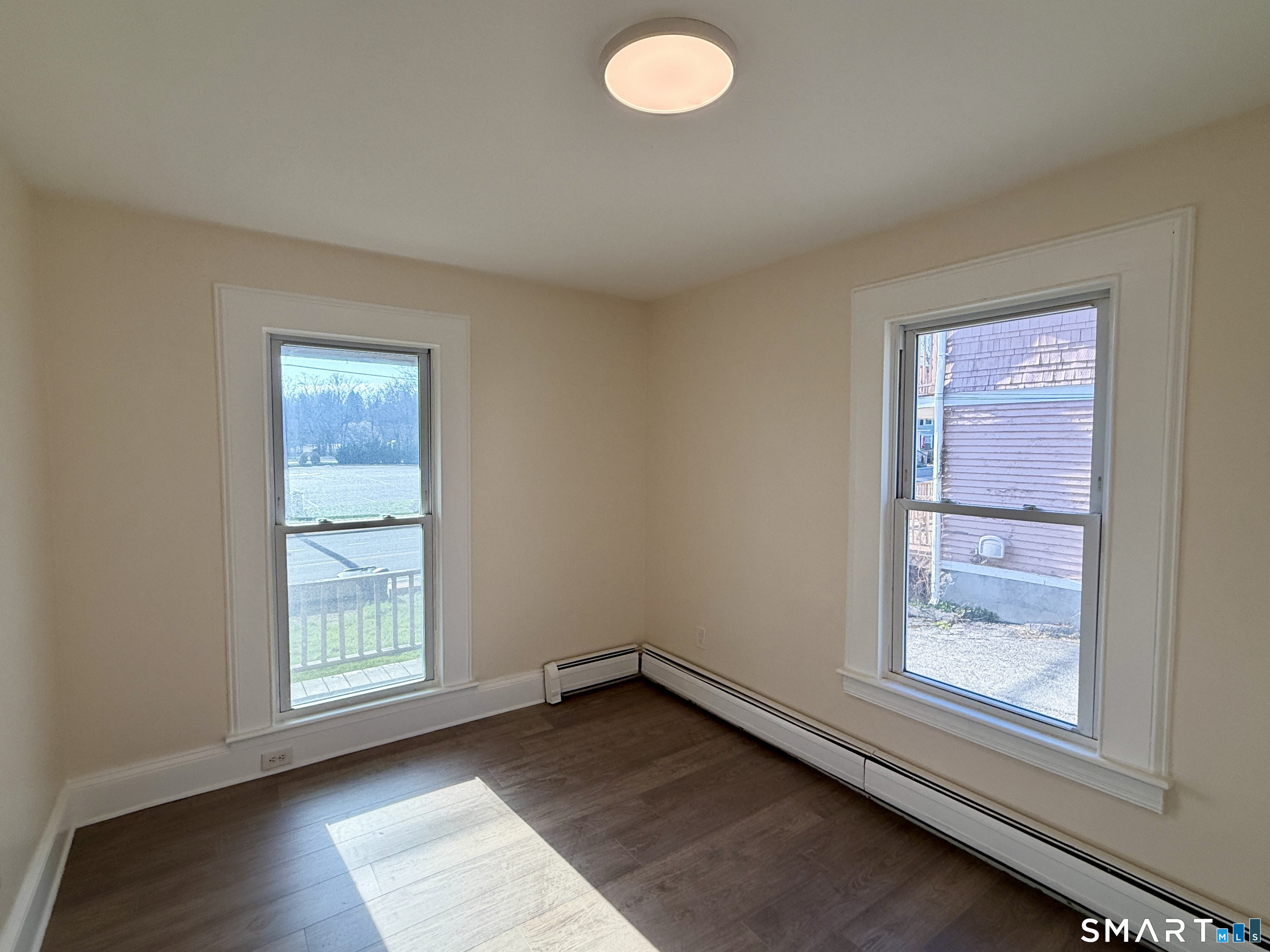 690 Main Street, Unit 1 Torrington, CT 06790 - Photo 7 of 12 an empty room with windows