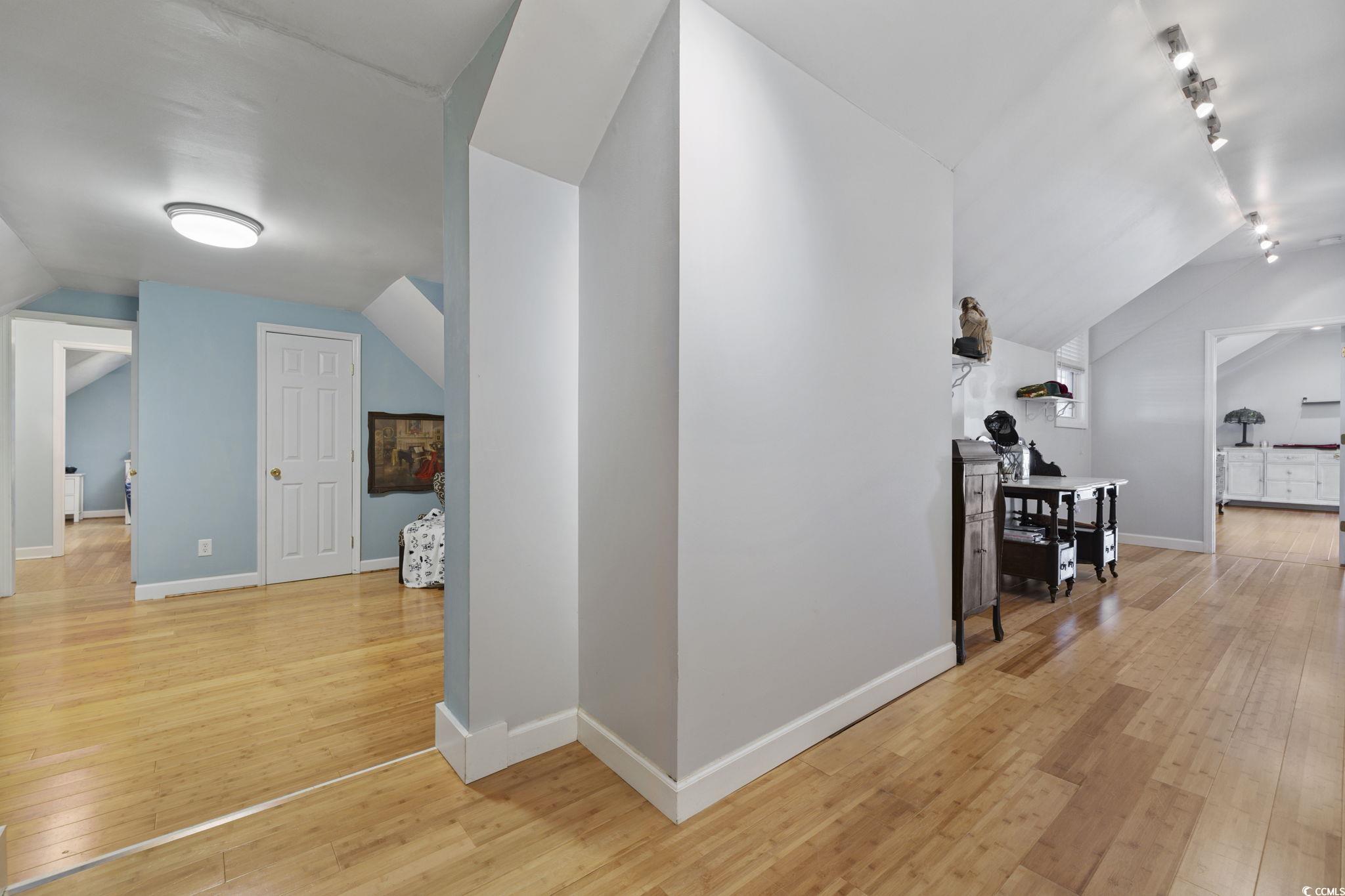 153 Watson Way Pawleys Island, SC 29585 - Photo 13 of 40 Bonus room with vaulted ceiling and light wood-style floors