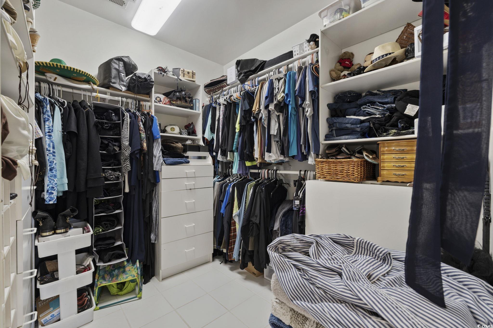153 Watson Way Pawleys Island, SC 29585 - Photo 20 of 40 Walk in closet with light tile patterned floors