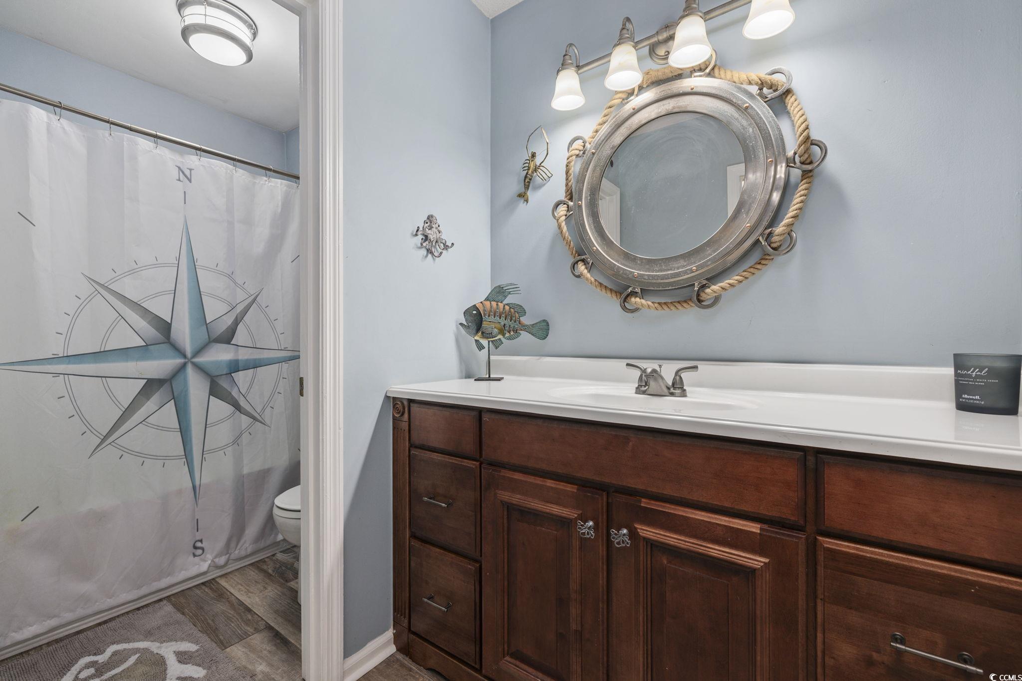 153 Watson Way Pawleys Island, SC 29585 - Photo 23 of 40 Bathroom featuring vanity and dark wood-style floors