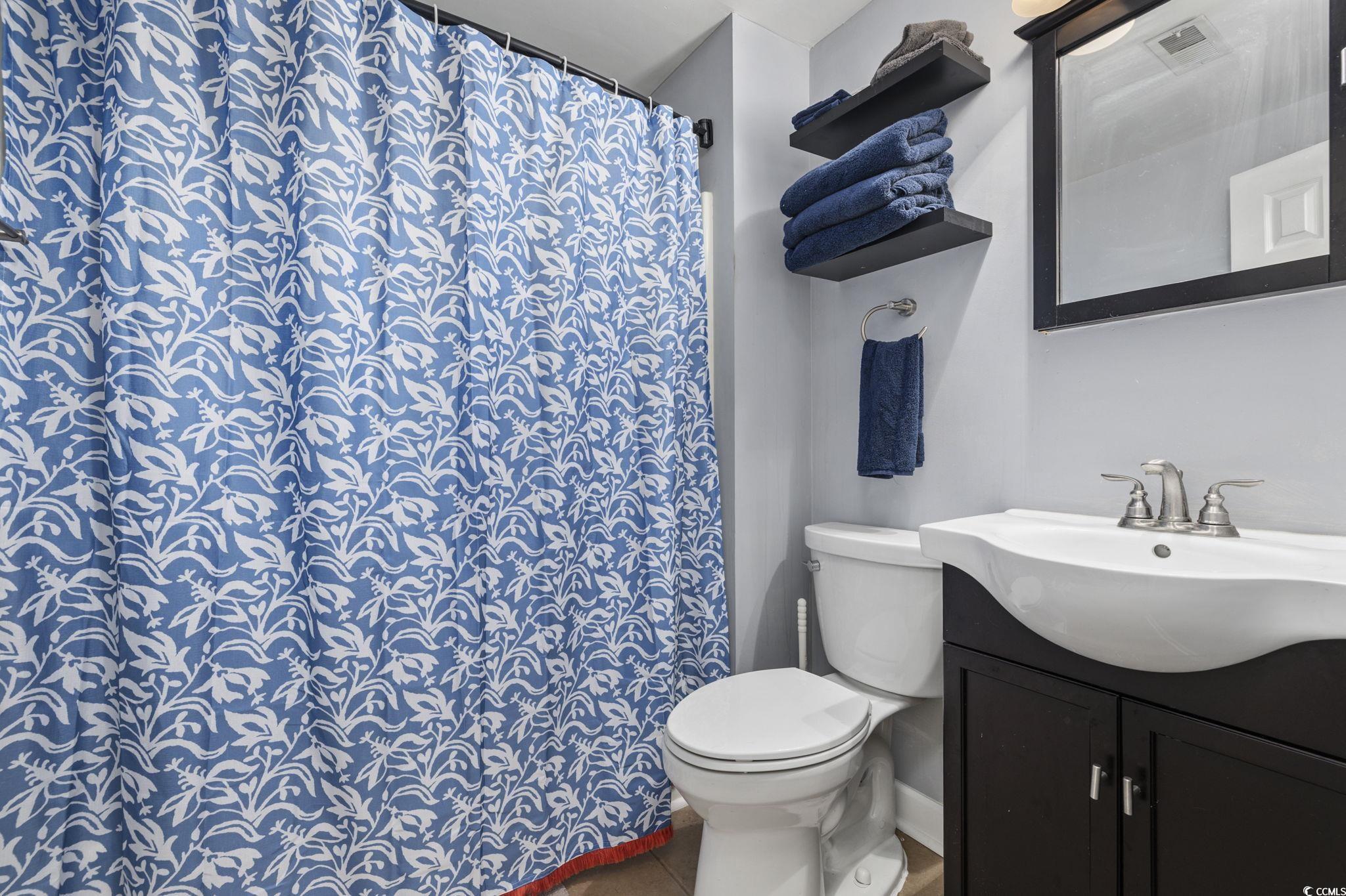 153 Watson Way Pawleys Island, SC 29585 - Photo 24 of 40 Full bathroom featuring a shower with curtain and vanity