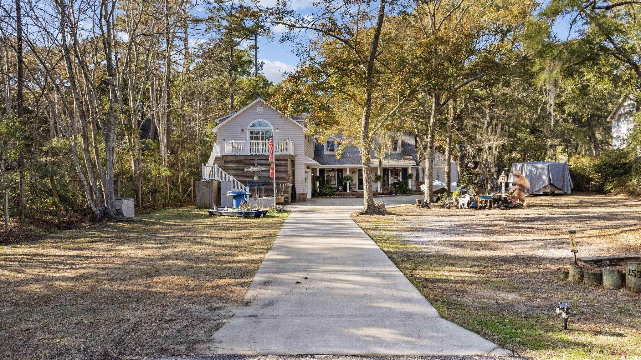 153 Watson Way Pawleys Island, SC 29585 - Photo 3 of 40 View of front of house featuring a balcony and stairway