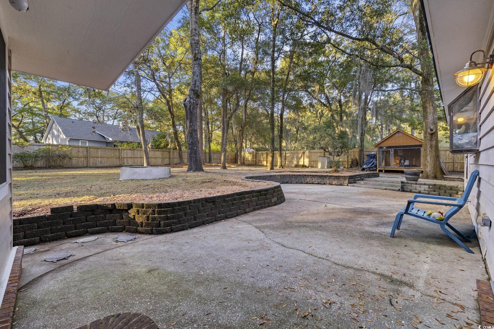 153 Watson Way Pawleys Island, SC 29585 - Photo 32 of 40 Fenced backyard featuring a patio area