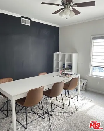 a workspace with furniture and window