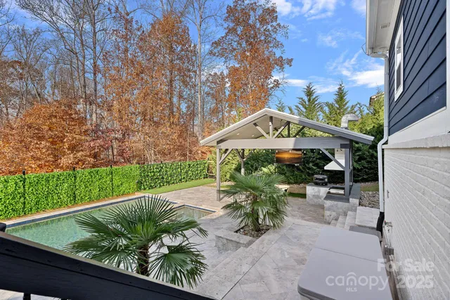 a backyard of a house with a garden and plants