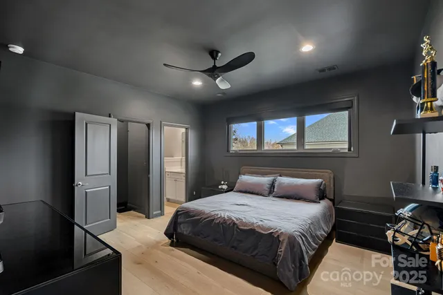 a room with lots of chairs and a flat screen tv