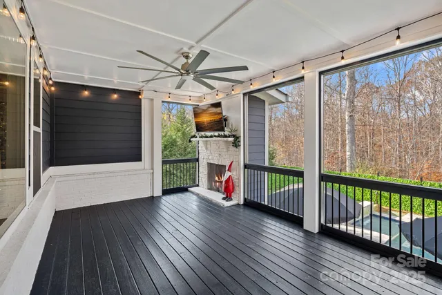 a swimming pool view with a outdoor seating