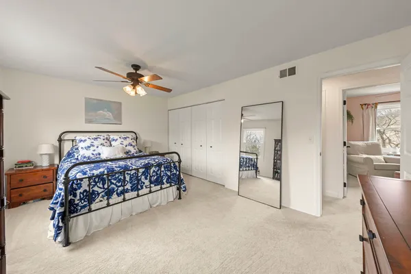 a bedroom with furniture and window