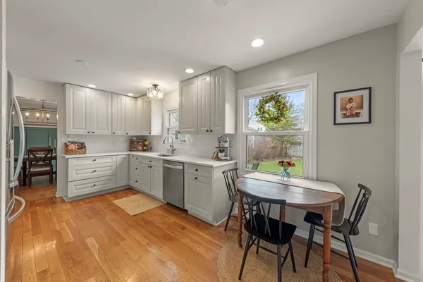 a kitchen with a table and chairs in it