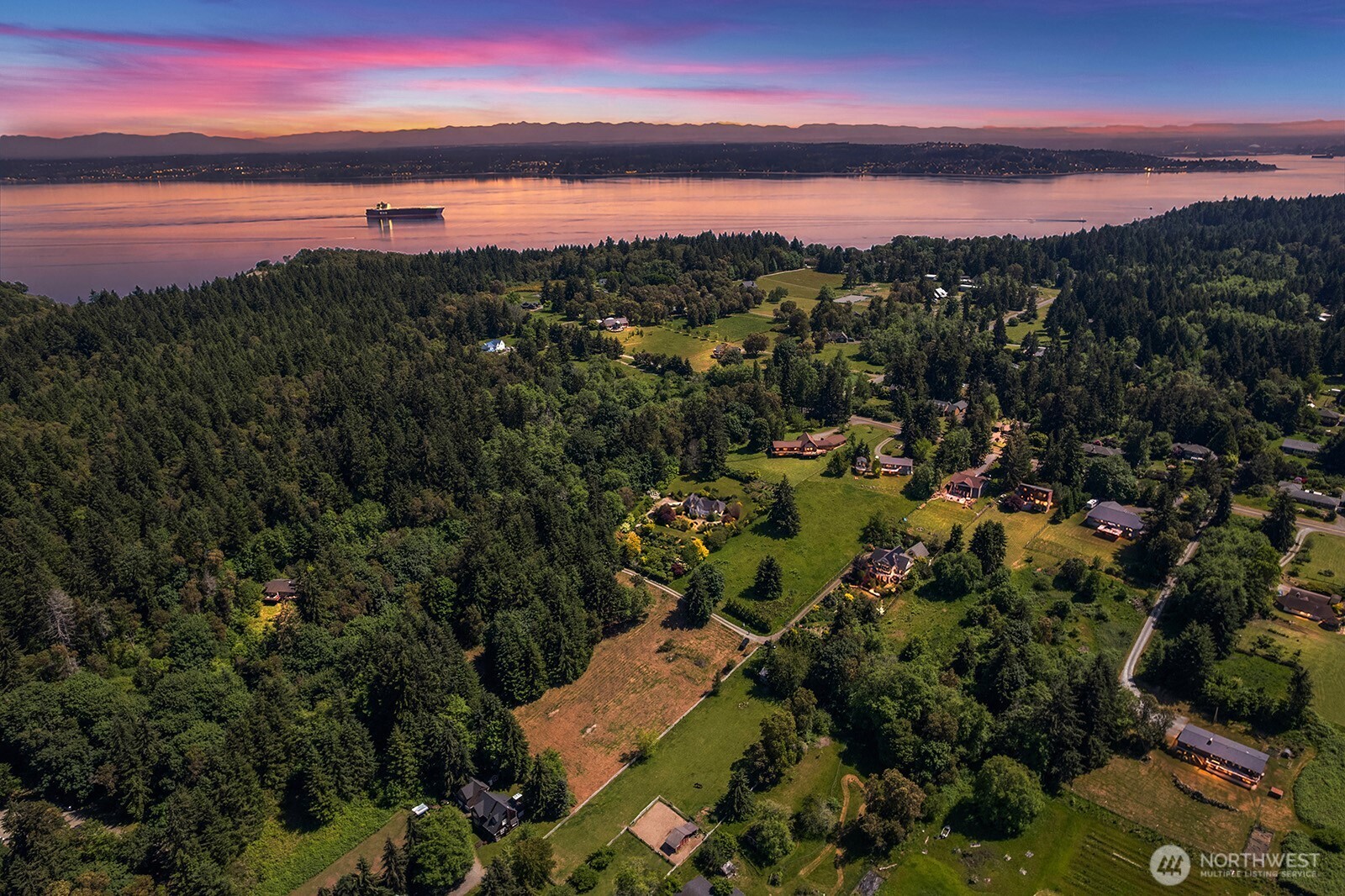 9438 Southwest 266th Lane Vashon, WA 98070 - Photo 18 of 24 a view of a city and sunset
