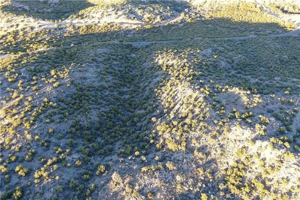 a view of mountain with yard