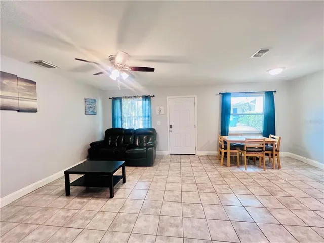 a living room with furniture and a window