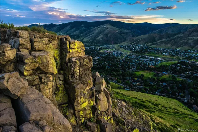 a view of a yard and mountain view in back