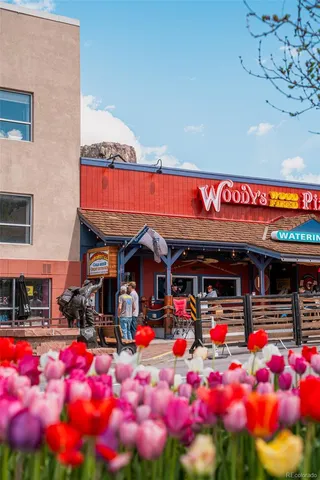 a view of a chairs and table in a patio