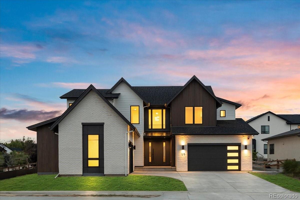 14455 Anvil Way Golden, CO 80403 - Photo 2 of 35 a front view of a house with a garden