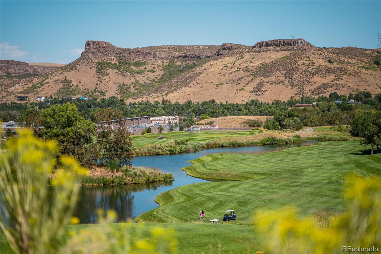 14455 Anvil Way Golden, CO 80403 - Photo 26 of 35 a view of a lake with mountains in the background
