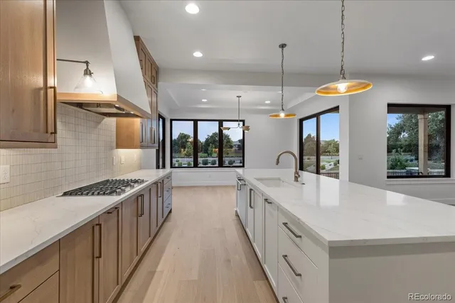 a large kitchen with stainless steel appliances a large counter space