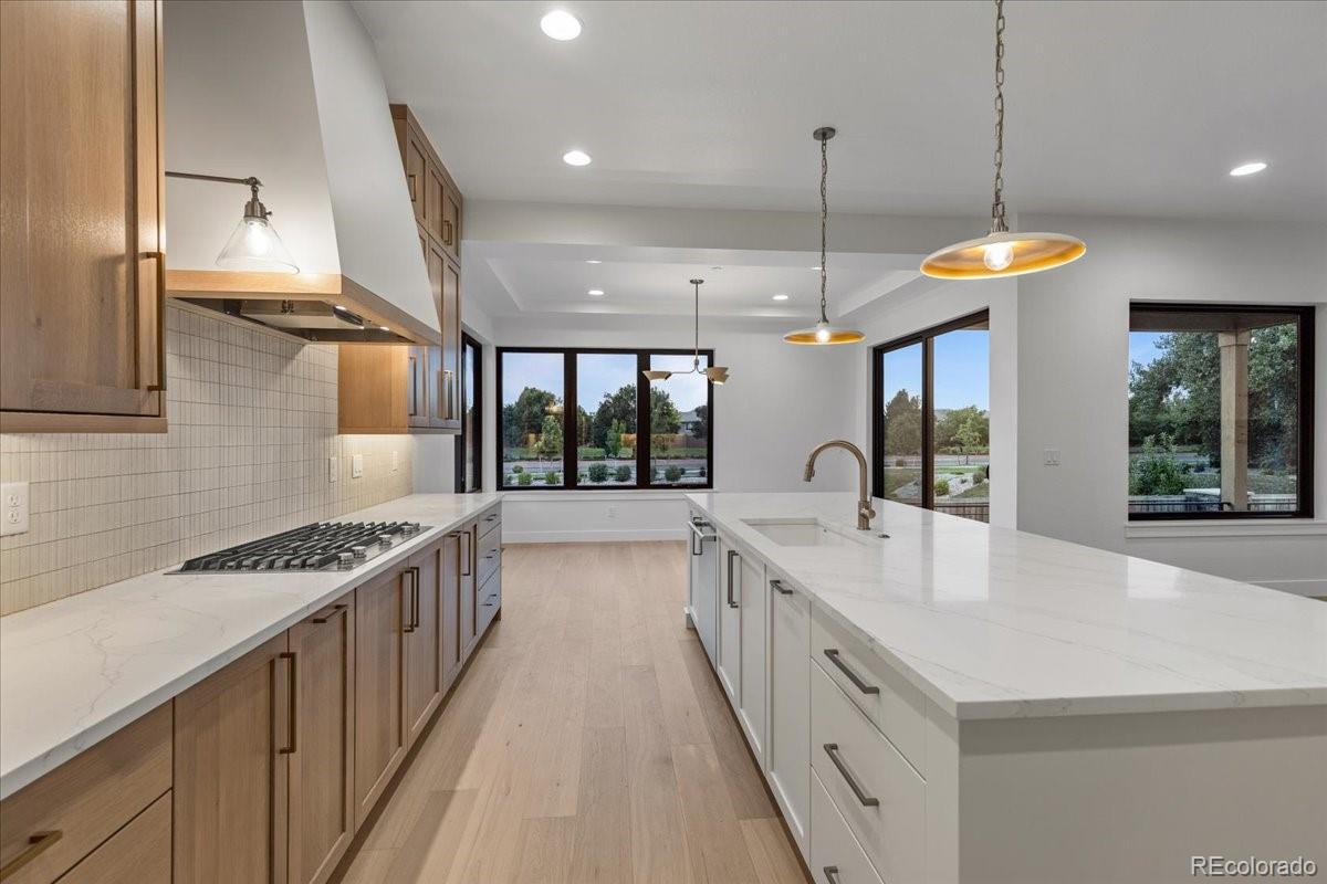 14455 Anvil Way Golden, CO 80403 - Photo 6 of 35 a large kitchen with stainless steel appliances a large counter space