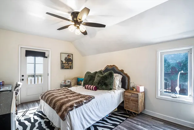 a bedroom with a bed and window