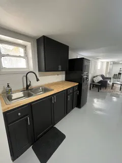 a kitchen with a sink and cabinets