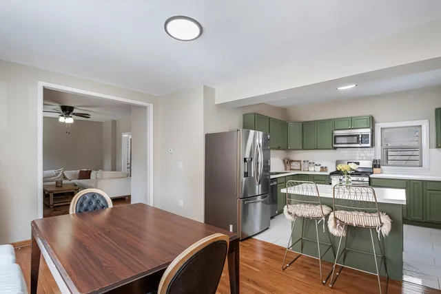 a kitchen with a table and chairs