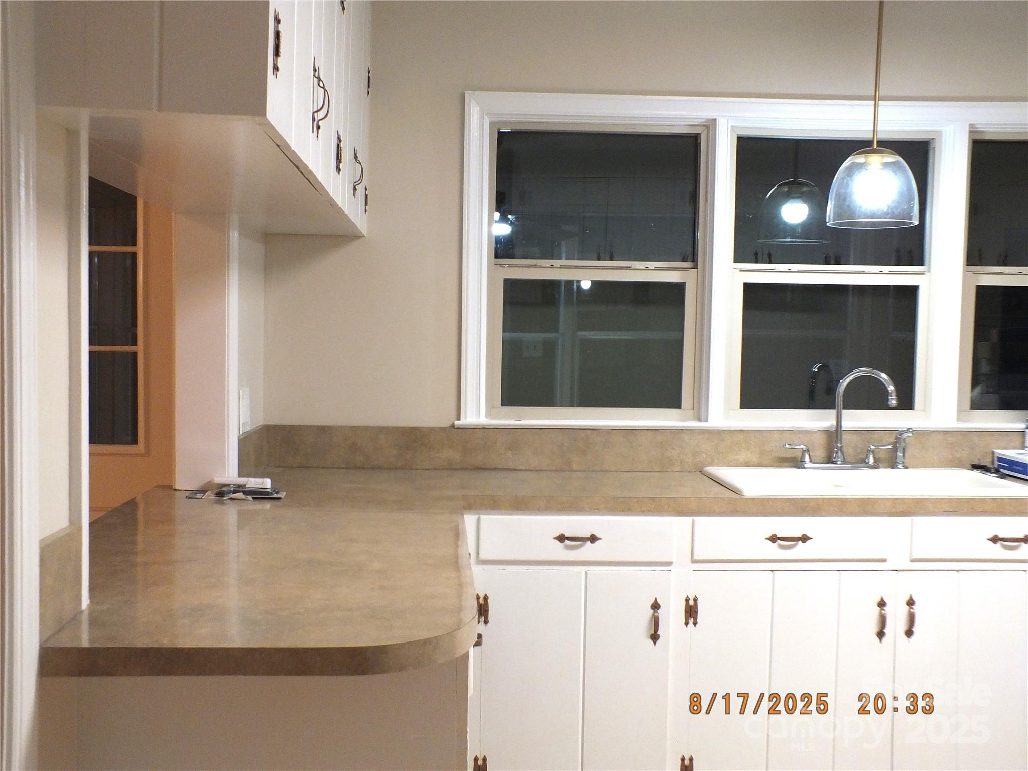 414 West Springs Street Lancaster, SC 29720 - Photo 12 of 27 a kitchen with a sink and a mirror
