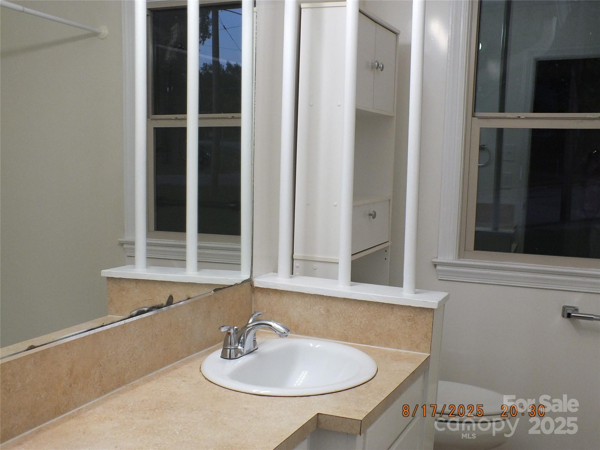 414 West Springs Street Lancaster, SC 29720 - Photo 21 of 27 a bathroom with a sink and a mirror