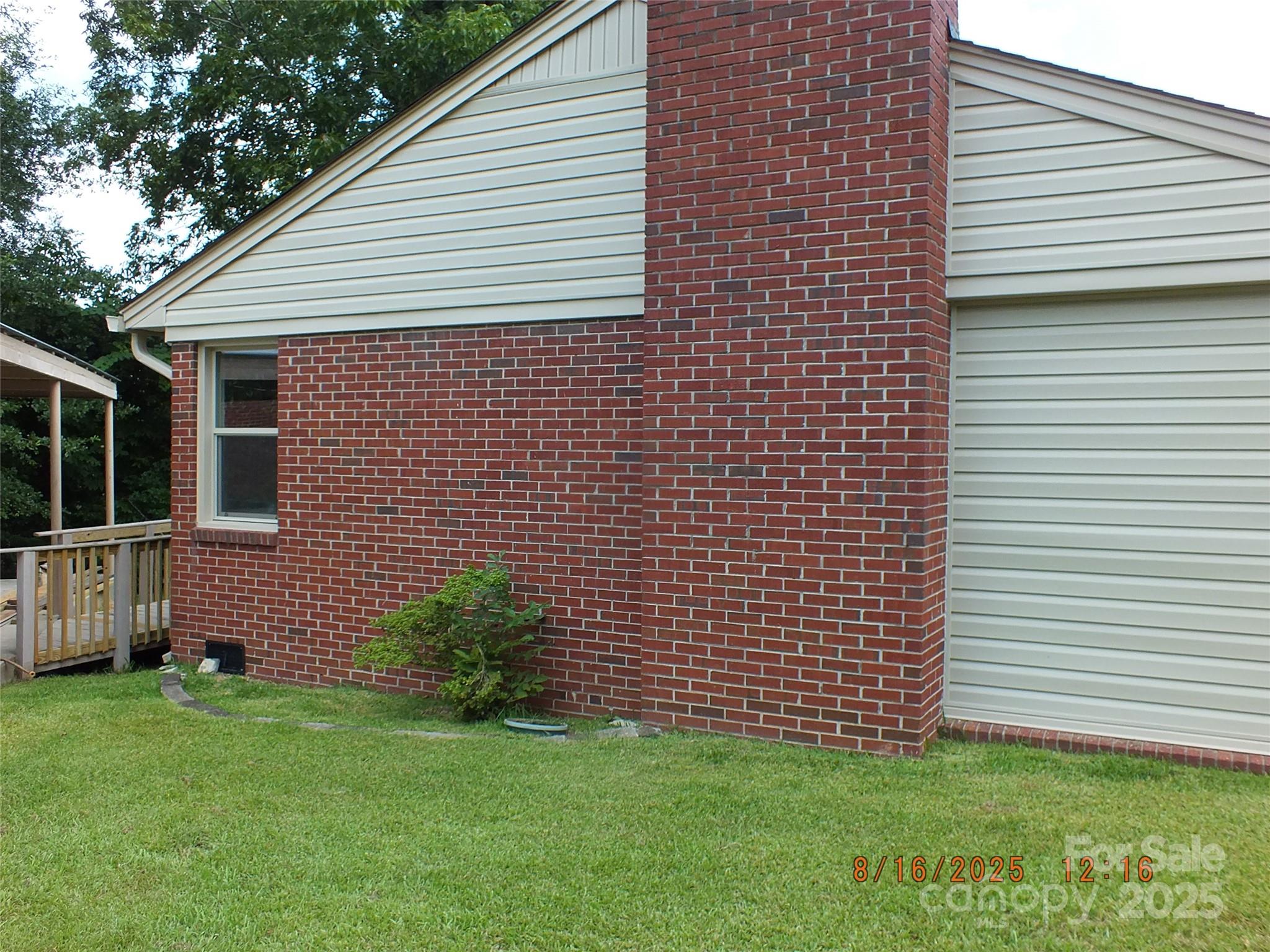 414 West Springs Street Lancaster, SC 29720 - Photo 24 of 27 a view of a backyard with plants