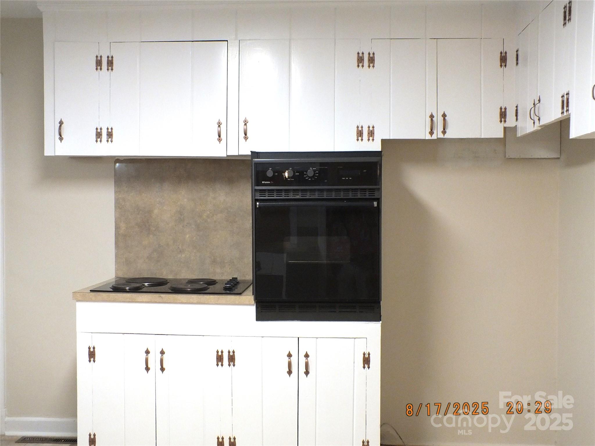 414 West Springs Street Lancaster, SC 29720 - Photo 9 of 27 a kitchen with stainless steel appliances granite countertop a stove and a microwave