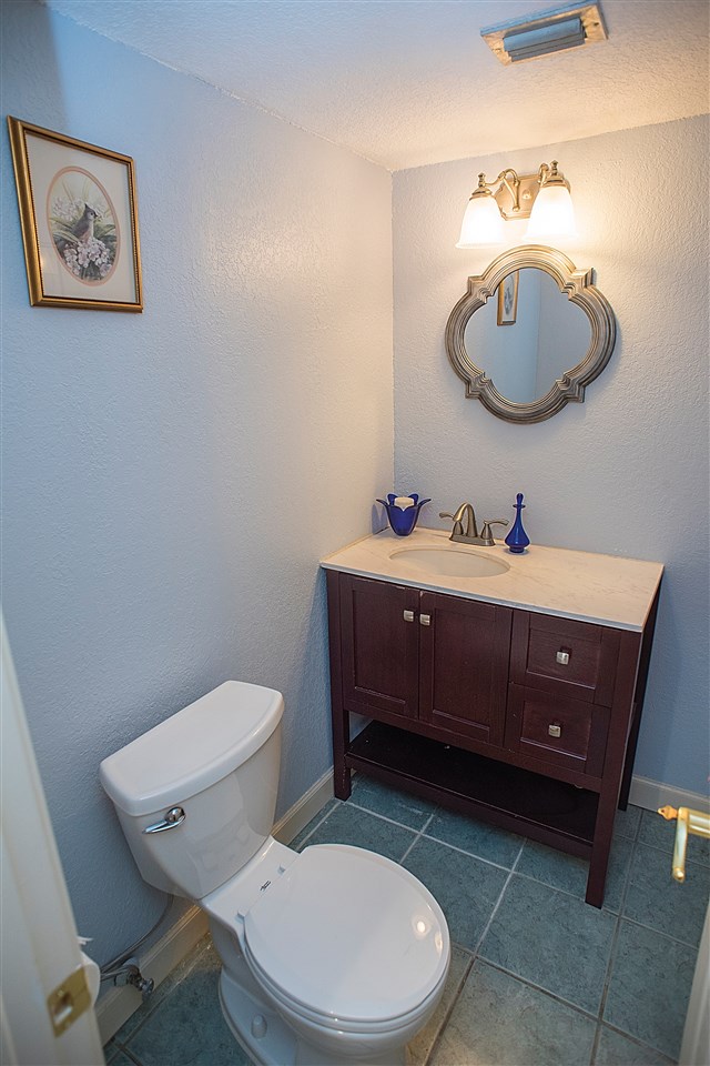 503 Royal Road St. Augustine, FL 32086 - Photo 12 of 34 a bathroom with a toilet a sink and mirror