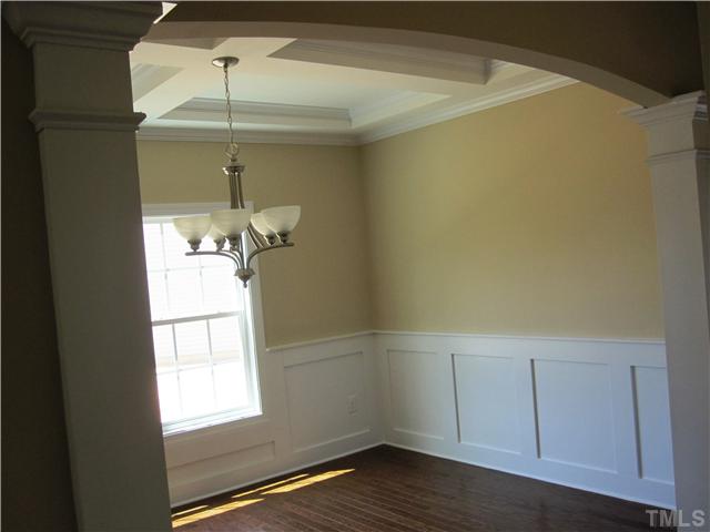 7608 Birchmoor Way, Unit LT75 Raleigh, NC 27616 - Photo 4 of 12 a room with wooden floors and chandelier