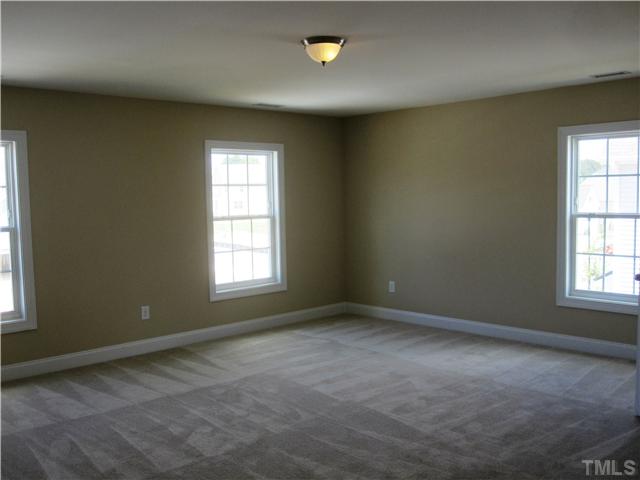 7608 Birchmoor Way, Unit LT75 Raleigh, NC 27616 - Photo 10 of 12 an empty room with a window