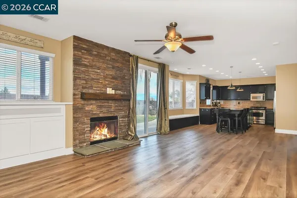 a view of a livingroom with furniture and a fireplace
