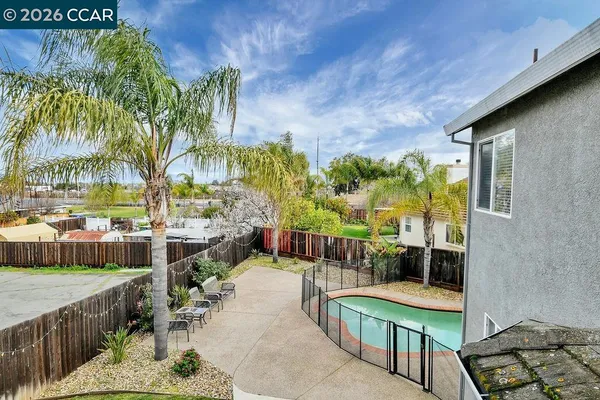 a view of a chairs and table in the patio
