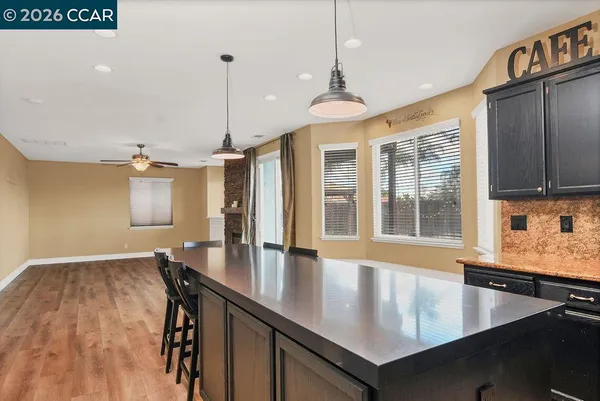 a view of kitchen and dining room with a chandelier