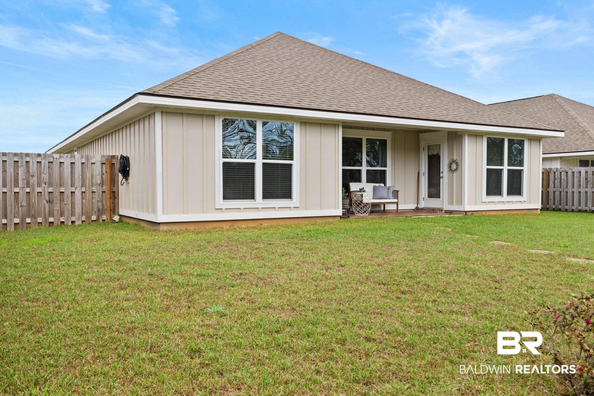 1203 Hayward Loop Foley, AL 36535 - Photo 34 of 41 Rear view of property with board and batten siding and a shingled roof