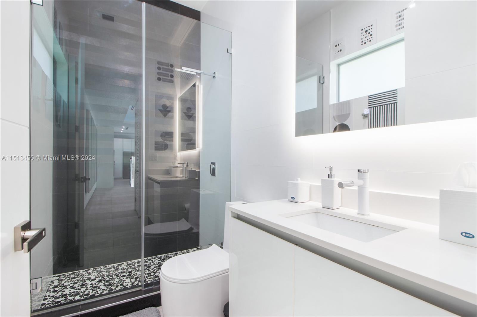 1500 Southwest 4th Avenue Miami, FL 33129 - Photo 23 of 24 a bathroom with a sink a toilet and shower