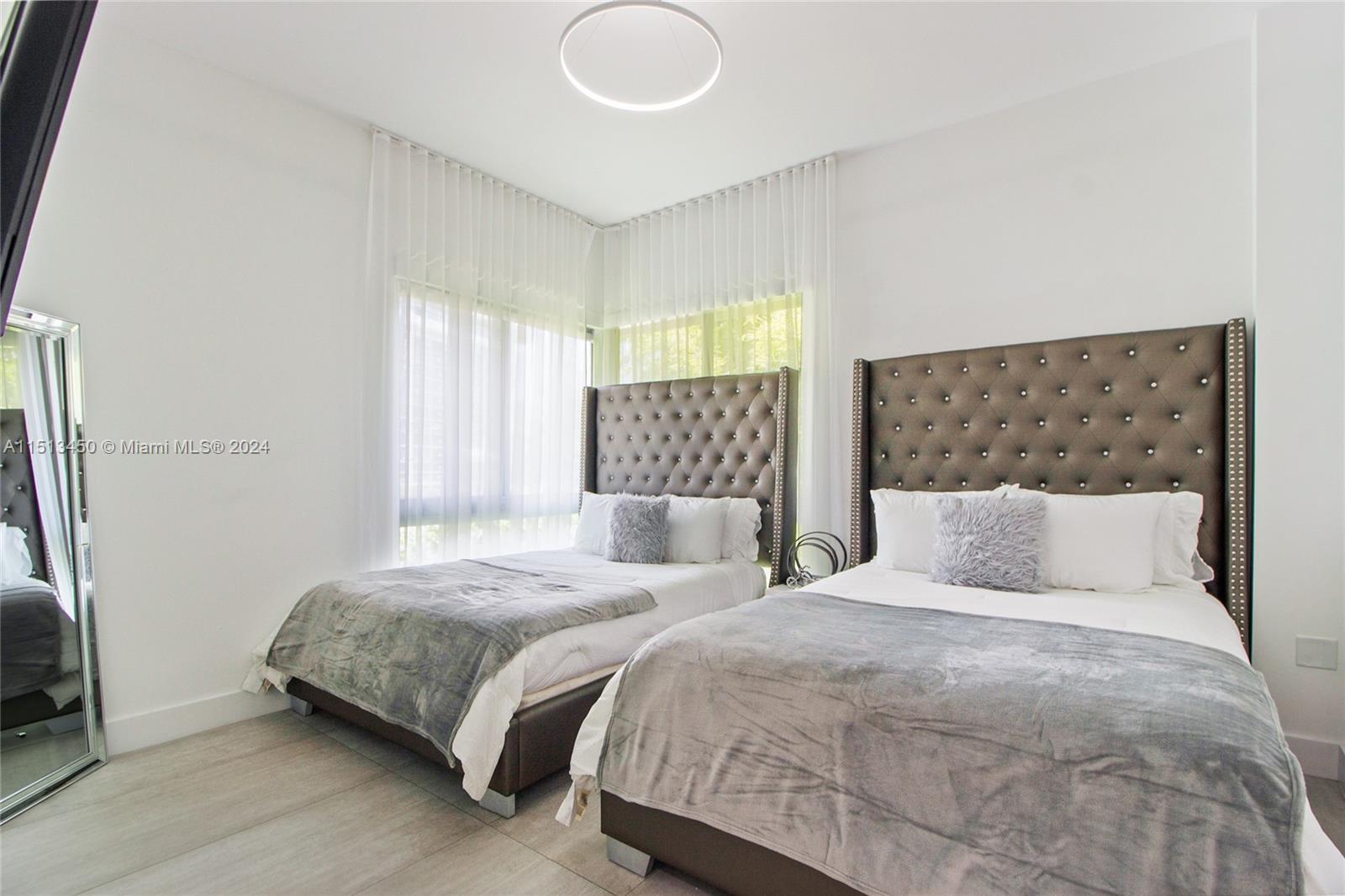 1500 Southwest 4th Avenue Miami, FL 33129 - Photo 24 of 24 a bedroom with two beds and a window