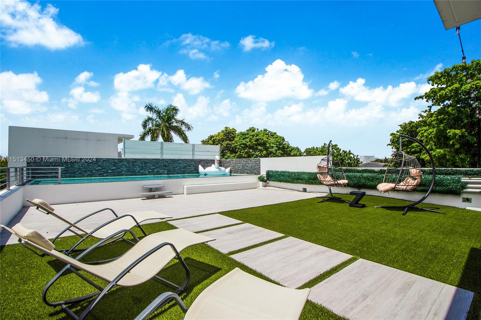 1500 Southwest 4th Avenue Miami, FL 33129 - Photo 7 of 24 a view of a swimming pool with lounge chairs