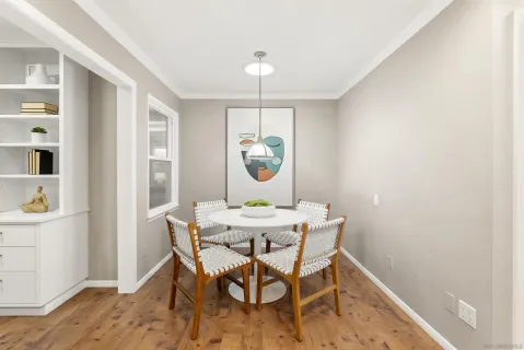 a view of a dining room with furniture window and wooden floor