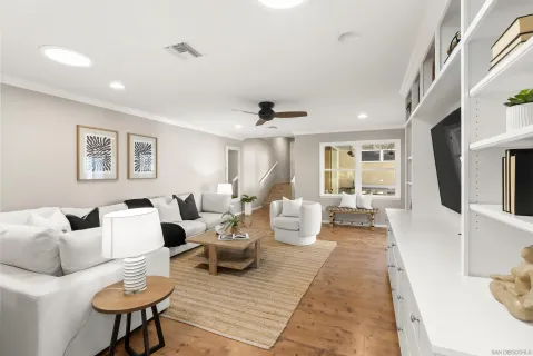a very nice looking living room with furniture and a large window