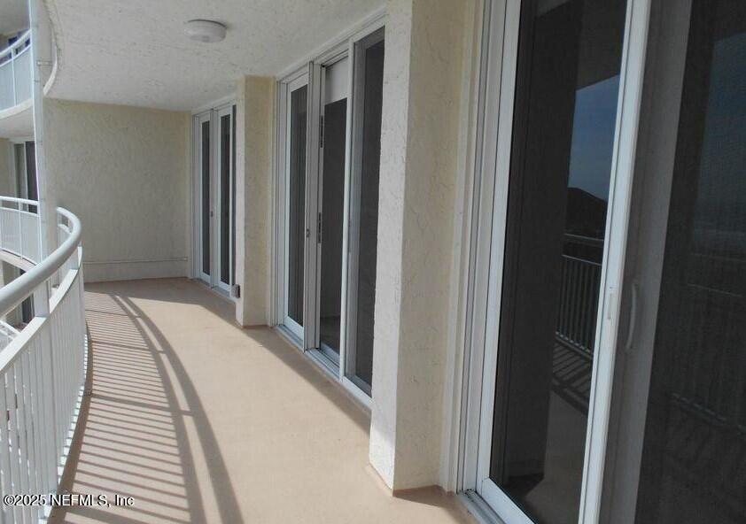1601 Ocean Drive South, Unit 309 Jacksonville Beach, FL 32250 - Photo 7 of 18 a view of bedroom with wooden floor