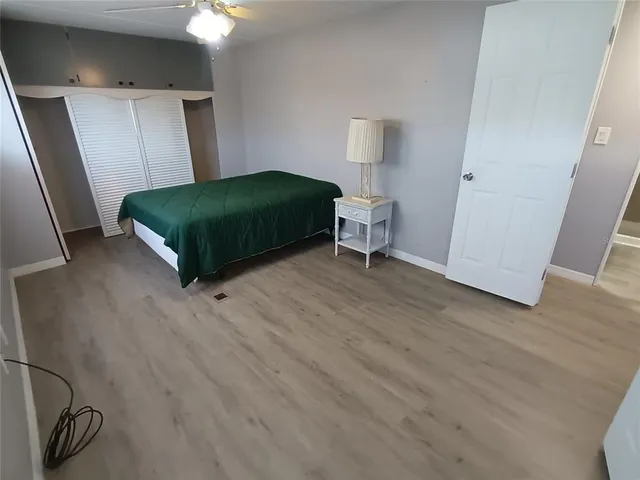 a living room with a bed and a table