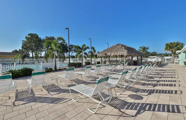 a view of a swimming pool with a lounge chair
