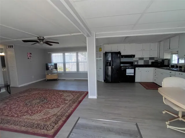 a large kitchen with cabinets