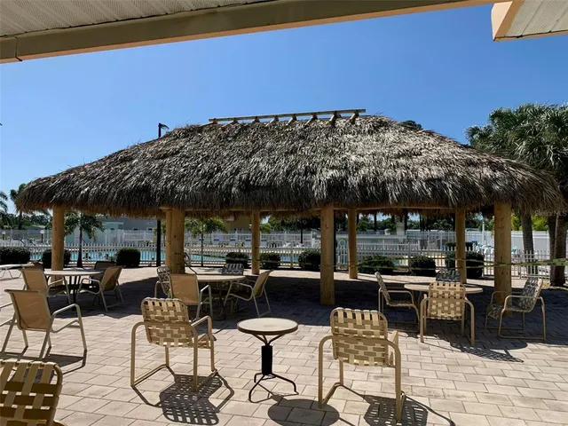 a view of a backyard with sitting area